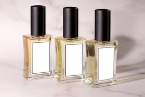 Home three glass perfume bottles mockup, on marble background